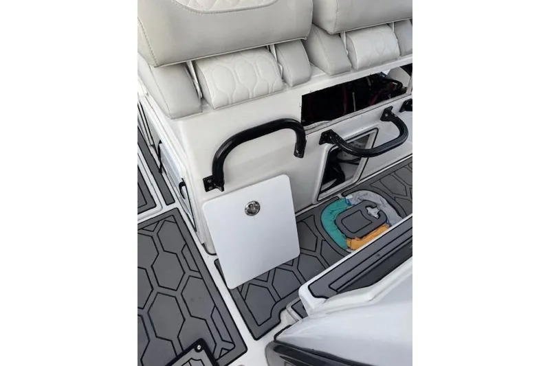 Slide: The Image of 2021 Sea Fox 368 Commander interior with cushioned seating and storage compartments. - 8