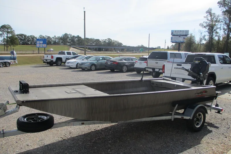 Slide: The Image of 2026 Gator Tail 1754 Extreme boat on trailer in parking lot. - 2