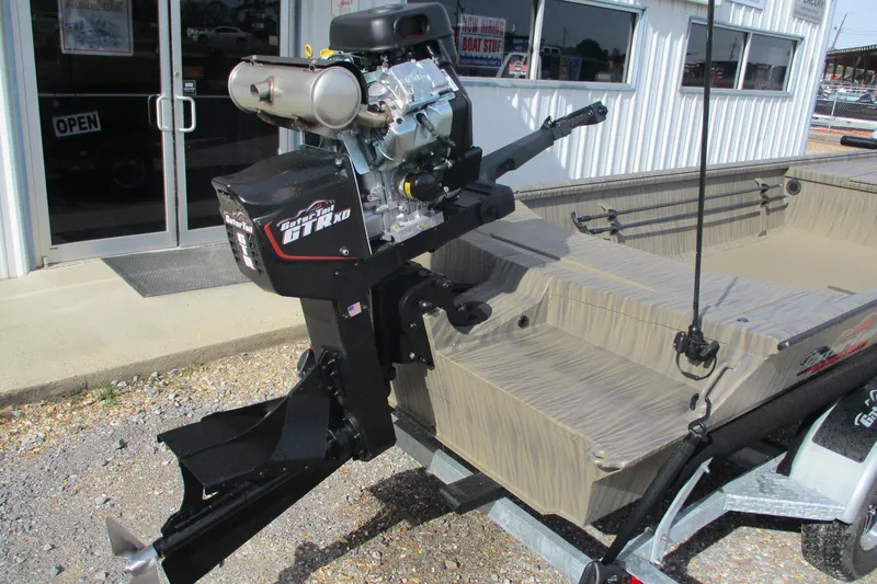 Slide: The Image of 2026 Gator Tail 1754 Extreme boat with powerful outboard motor, parked outside a store. - 5