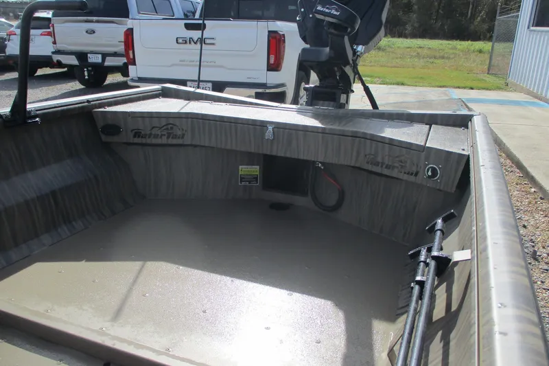 Slide: The Image of 2026 Gator Tail 1754 Extreme boat interior with motor, parked near GMC truck. - 7