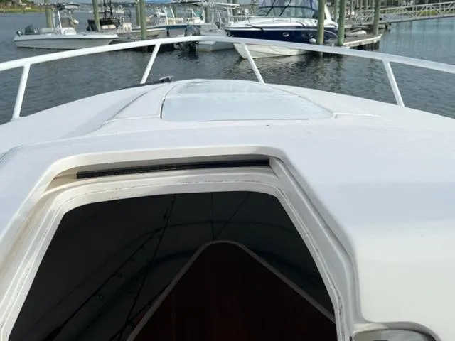 Slide: The Image of 2018 Intrepid 375 Walkaround boat bow with open cabin hatch. - 11