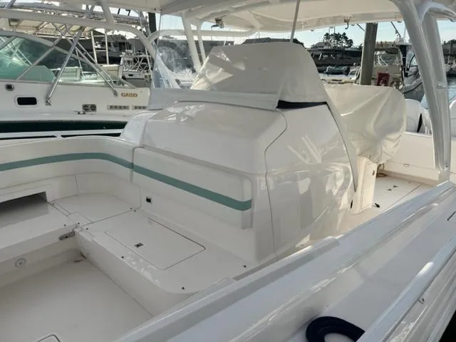 Slide: The Image of 2018 Intrepid 375 Walkaround boat interior with seating and storage compartments. - 15