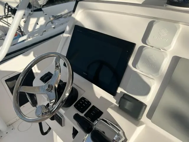 Slide: The Image of 2018 Intrepid 375 Walkaround helm with steering wheel and control panel. - 16