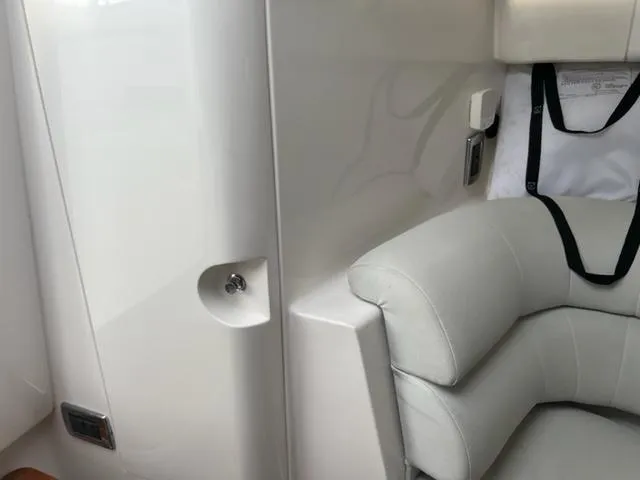 Slide: The Image of Interior seating of 2018 Intrepid 375 Walkaround boat with white upholstery. - 22