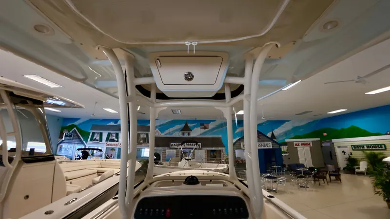 Slide: The Image of Interior view of a 2026 Grady-White Fisherman 216 boat in showroom. - 13