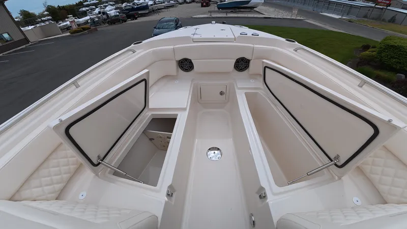Slide: The Image of Grady-White Freedom 275 boat 2026 with open storage compartments. - 32