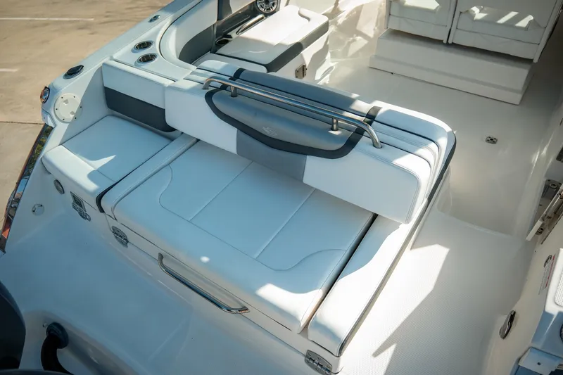 Slide: The Image of 2021 Chaparral 280 OSX boat interior with white seating and sleek design. - 10