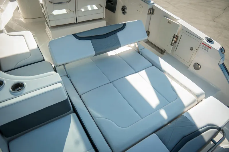 Slide: The Image of 2021 Chaparral 280 OSX boat interior with luxurious white seating and modern design. - 13