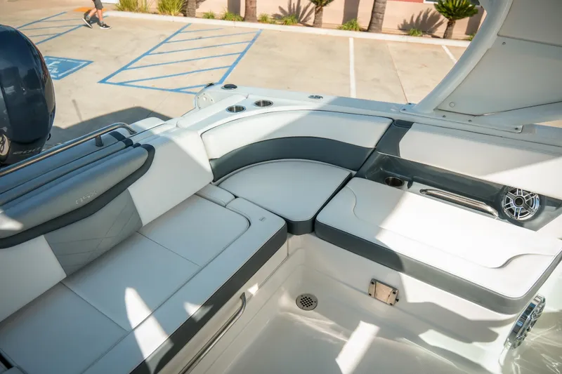 Slide: The Image of 2021 Chaparral 280 OSX boat interior with sleek seating and modern design. - 15