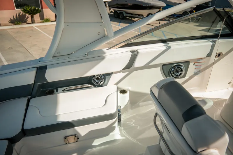 Slide: The Image of 2021 Chaparral 280 OSX boat interior with seating and speaker details. - 16