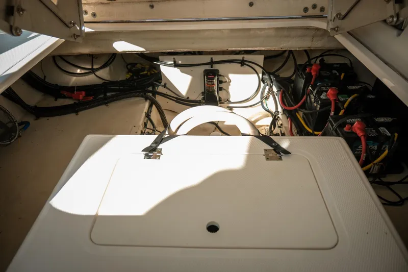 Slide: The Image of 2021 Chaparral 280 OSX boat engine compartment with wiring and battery setup. - 19