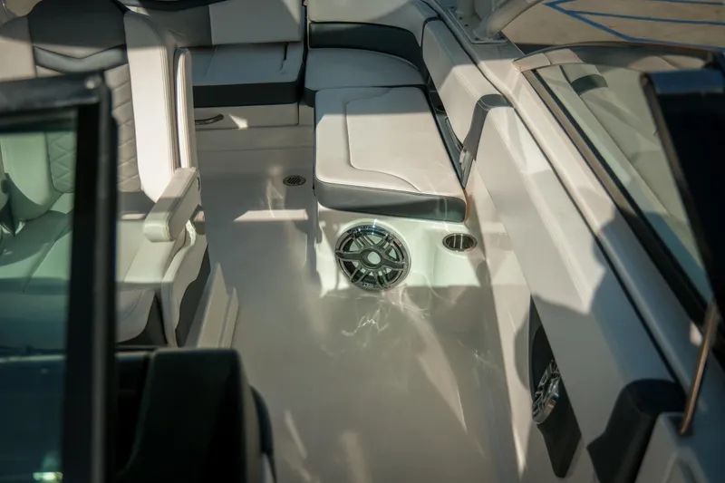 Slide: The Image of Interior of 2021 Chaparral 280 OSX boat with luxurious seating and speaker system. - 26