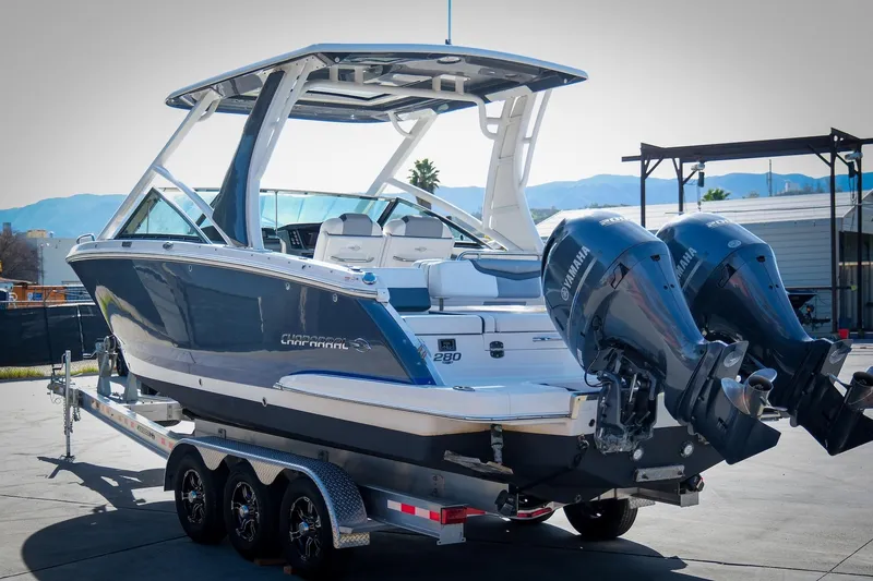 Slide: The Image of 2021 Chaparral 280 OSX boat on trailer with dual Yamaha outboard engines. - 6