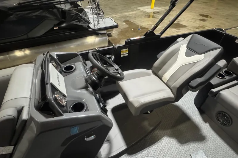 Slide: The Image of Interior of 2026 Evotti 521CS boat featuring modern steering and seating. - 10