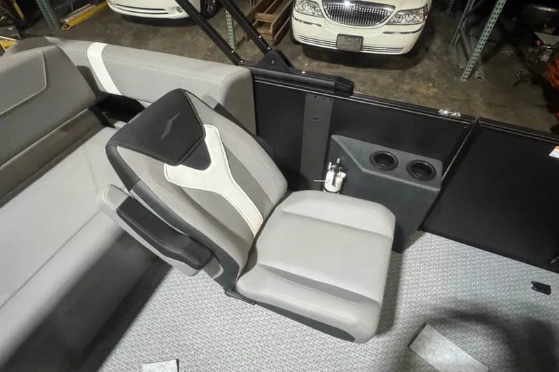 Slide: The Image of Evotti 521CS 2026 boat interior with gray seating and cup holders. - 12