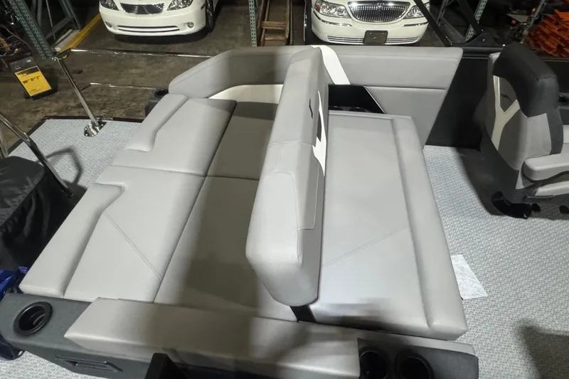 Slide: The Image of Interior of 2026 Evotti 521CS boat with gray seating and cup holders. - 15
