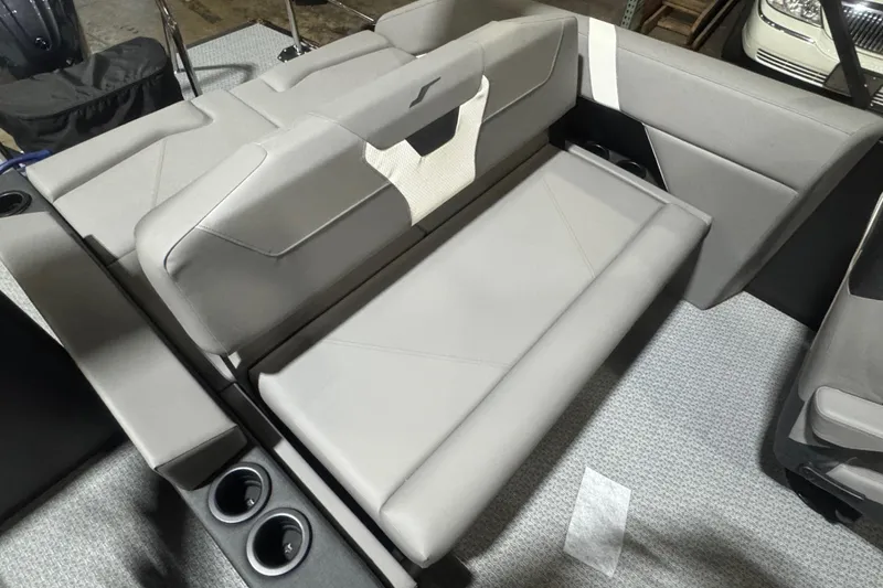 Slide: The Image of 2026 Evotti 521CS boat interior with gray seating and cup holders. - 16