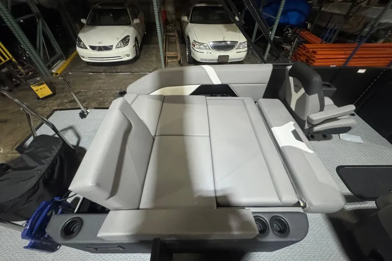 Slide: The Image of Interior of 2026 Evotti 521CS with gray seating and cup holders in a garage setting. - 17