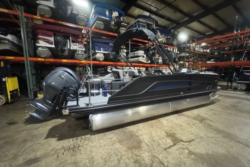 Slide: The Image of 2026 Evotti 521CS pontoon boat in storage, showcasing sleek design and powerful engine. - 3