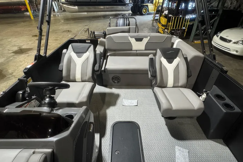Slide: The Image of Interior of 2026 Evotti 521CS boat with modern seating and steering wheel. - 9