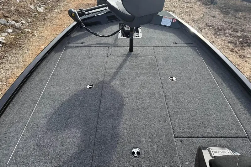 Slide: The Image of 2026 Lowe Stinger 195 Bass boat deck with seating and storage compartments. - 10