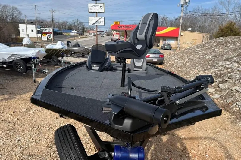 Slide: The Image of 2026 Lowe Stinger 195 Bass boat with fishing seat and trolling motor. - 2