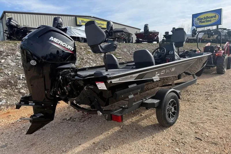 Slide: The Image of 2026 Lowe Stinger 195 Bass boat with Mercury engine at BlackBeard Marine dealership. - 6
