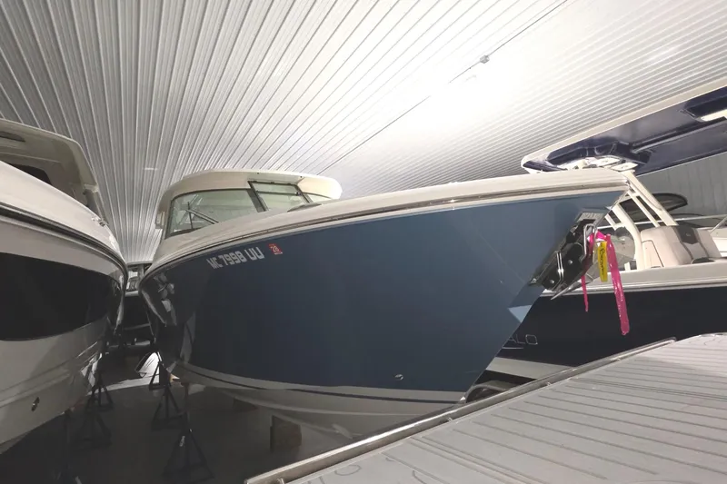 The Image of 2023 Tiara Sport 34LX boat on water, featuring sleek design and modern amenities. - 0