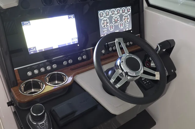 Slide: The Image of 2023 Tiara Sport 34LX boat hull on supports in a storage facility. - 14