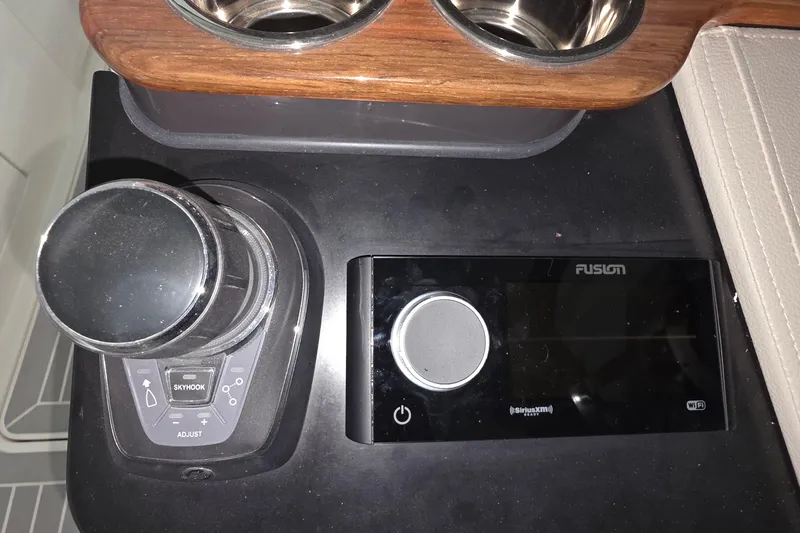 Slide: The Image of 2023 Tiara Sport 34LX boat hull on stands in a workshop. - 15