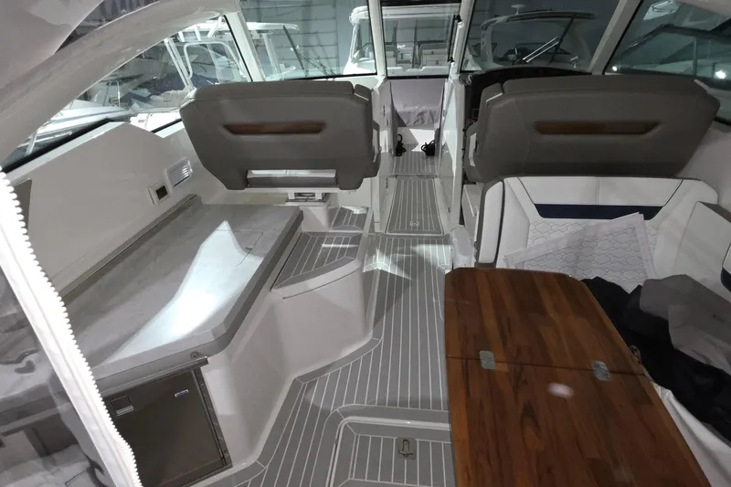 Slide: The Image of 2023 Tiara Sport 34LX helm with modern controls and luxurious seating. - 18
