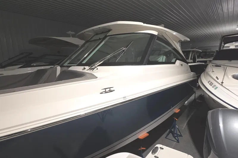 Slide: The Image of 2023 Tiara Sport 34LX boat in a shipyard. - 2