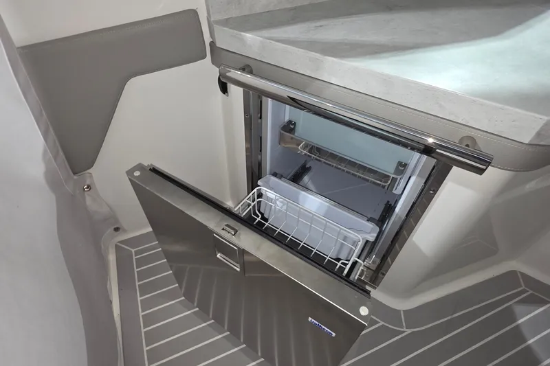 Slide: The Image of 2023 Tiara Sport 34LX helm with modern controls and digital displays. - 20