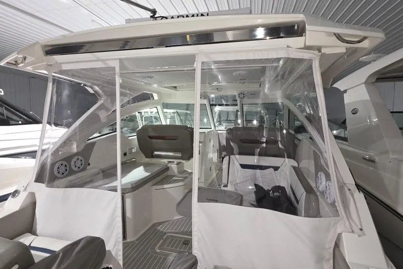 Slide: The Image of 2023 Tiara Sport 34LX boat helm with modern controls and comfortable seating. - 26