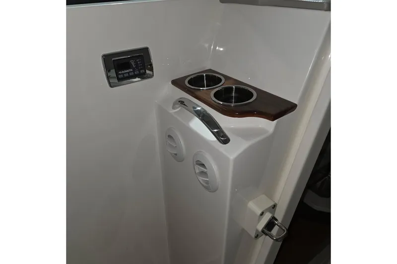 Slide: The Image of Control panel of 2023 Tiara Sport 34LX with joystick and Fusion audio system. - 27