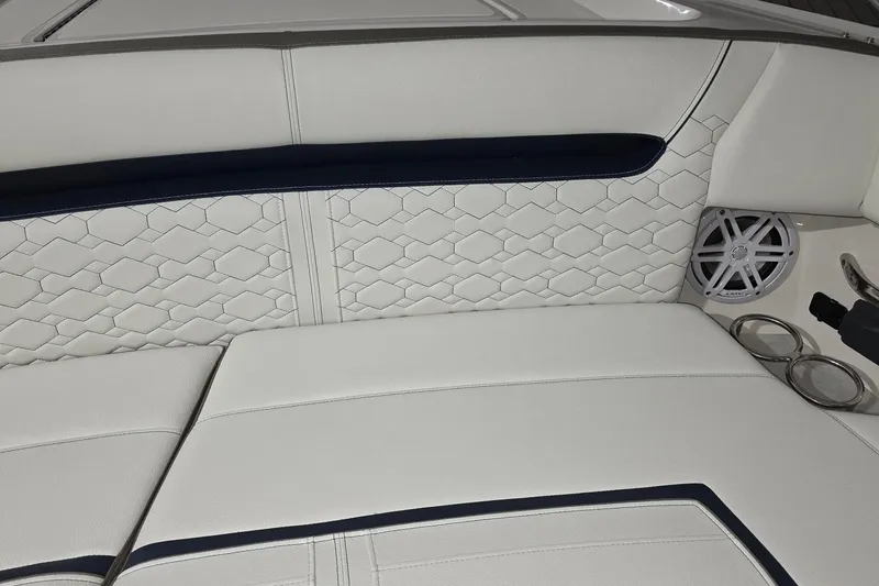 Slide: The Image of 2023 Tiara Sport 34LX boat interior with seating and wooden table. - 31