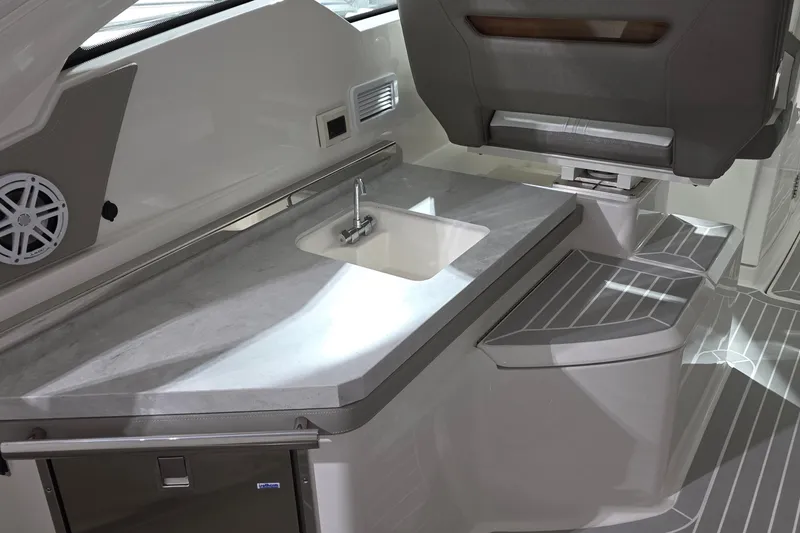 Slide: The Image of Interior of 2023 Tiara Sport 34LX boat, featuring modern seating and sleek design. - 32