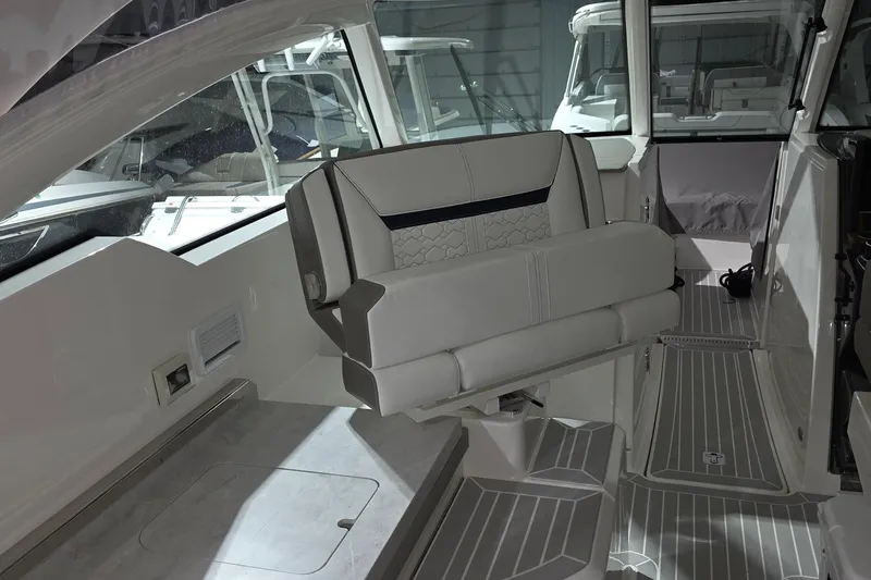 Slide: The Image of 2023 Tiara Sport 34LX interior with seating and cup holders. - 33