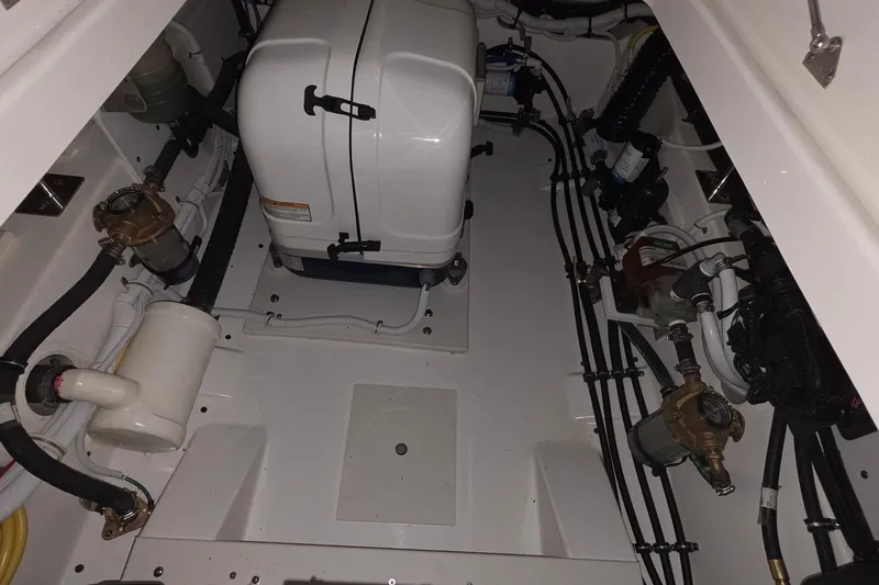 Slide: The Image of Open storage compartment in 2023 Tiara Sport 34LX boat. - 34