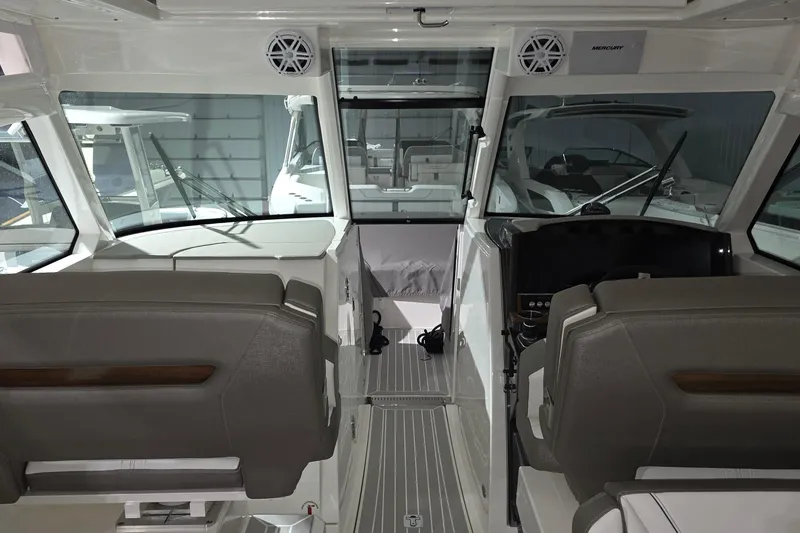 Slide: The Image of Open refrigerator on 2023 Tiara Sport 34LX boat, showcasing modern interior design. - 36