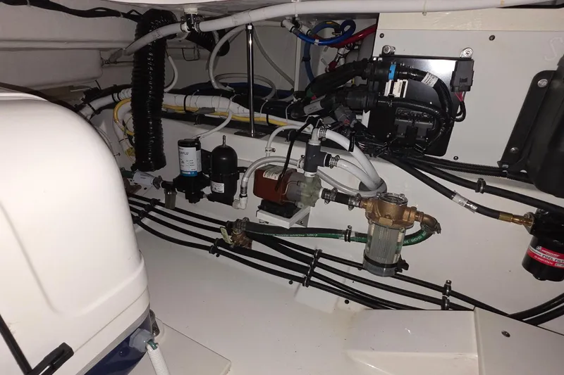 Slide: The Image of 2023 Tiara Sport 34LX boat bathroom with sink and toilet. - 37