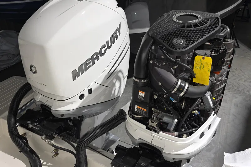 Slide: The Image of 2023 Tiara Sport 34LX engine compartment with electrical components and wiring. - 55