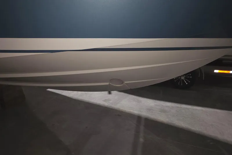 Slide: The Image of 2023 Tiara Sport 34LX boat with sleek design and modern features. - 6