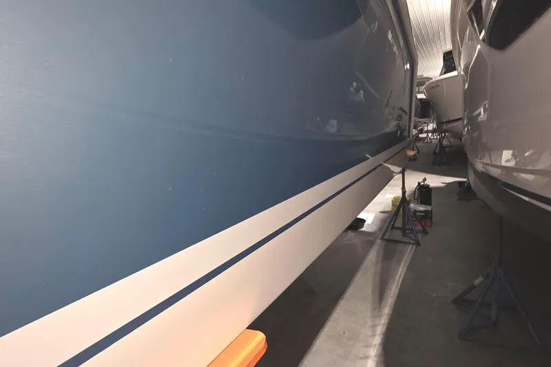 Slide: The Image of 2023 Tiara Sport 34LX boat in storage, showcasing sleek design and modern features. - 8