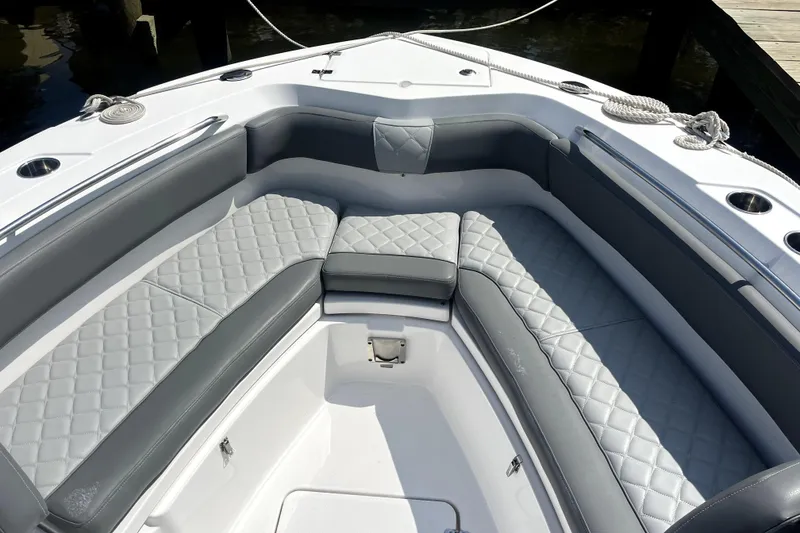 Slide: The Image of 2024 NauticStar 222L Offshore boat with luxurious gray seating and diamond stitching. - 5