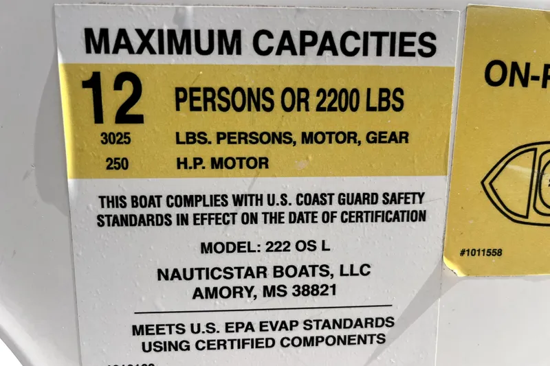 Slide: The Image of 2024 NauticStar 222L Offshore capacity label, 12 persons or 2200 lbs, U.S. Coast Guard compliant. - 9
