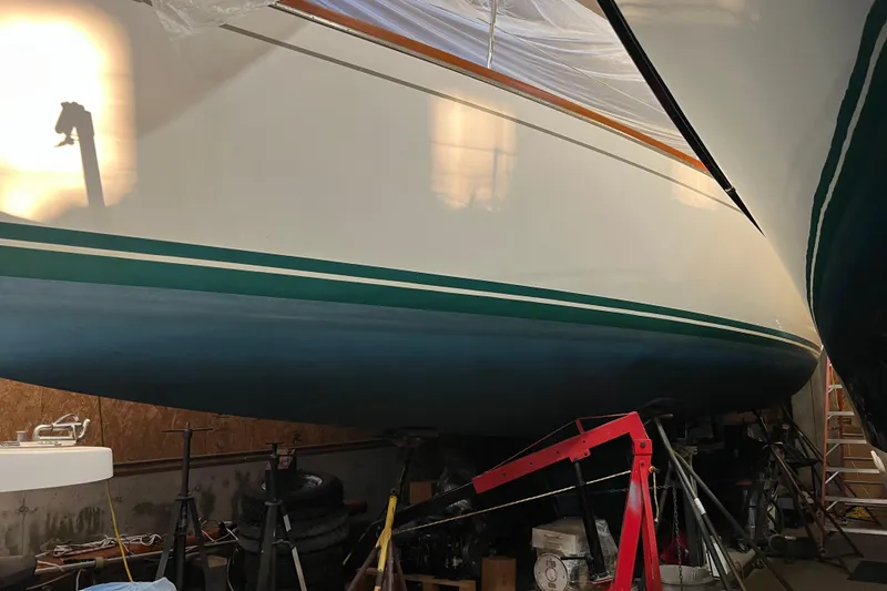 Slide: The Image of 2001 Tartan 3700 Sloop in storage, showcasing sleek hull design and vibrant colors. - 15