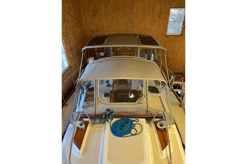 Slide: The Image of Tartan 3700 Sloop 2001 in storage, featuring deck and canopy view. - 11