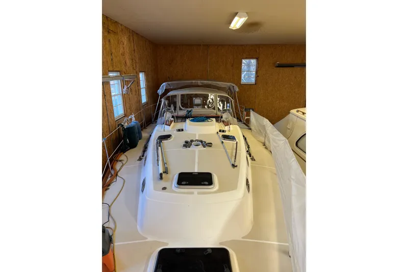 Slide: The Image of Tartan 3700 Sloop 2001 in storage, showcasing deck and cabin details. - 12