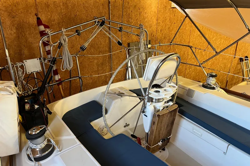 Slide: The Image of 2001 Tartan 3700 Sloop cockpit with steering wheel and rigging equipment. - 13